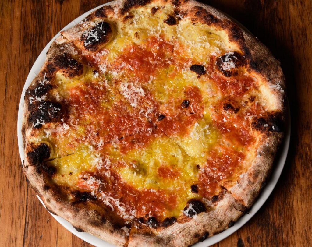A yellow and red tomato pie from Razza in Jersey City, made by Top 10 pizza maker in the world Dan Richer