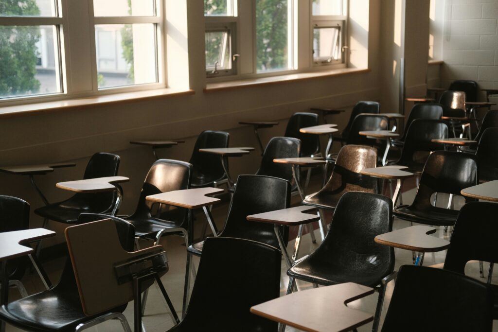 An empty classroom with rows of desks in a New Jersey public school