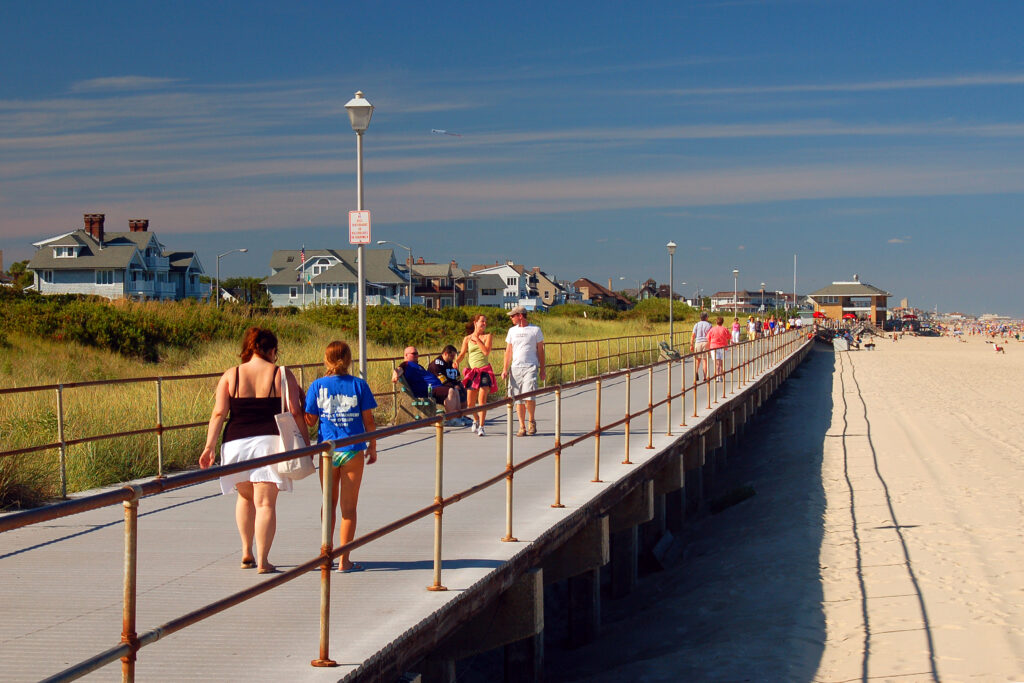 Visitors stroll along the boardwalk in Spring Lake, New Jersey on a summer day