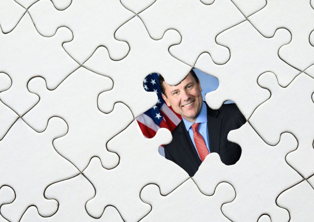 An illustration showing Rep. Tom Kean Jr. visible through a missing puzzle piece