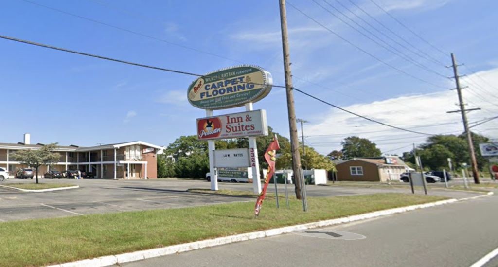 The exterior and signage of the former Pelican Inn and Suites in Toms River, New Jersey, now being converted into emergency housing.