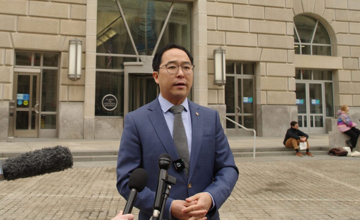 Sen. Andy Kim speaks to reporters outside a federal building in Washington, D.C.