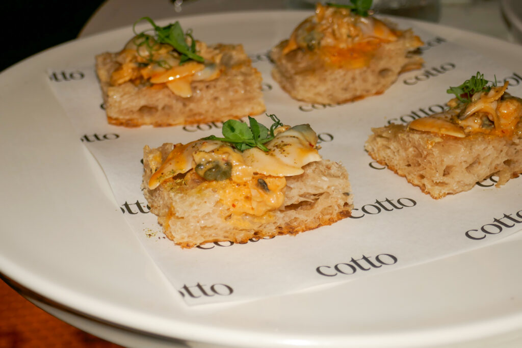 charred clam and schiacciata appetizer