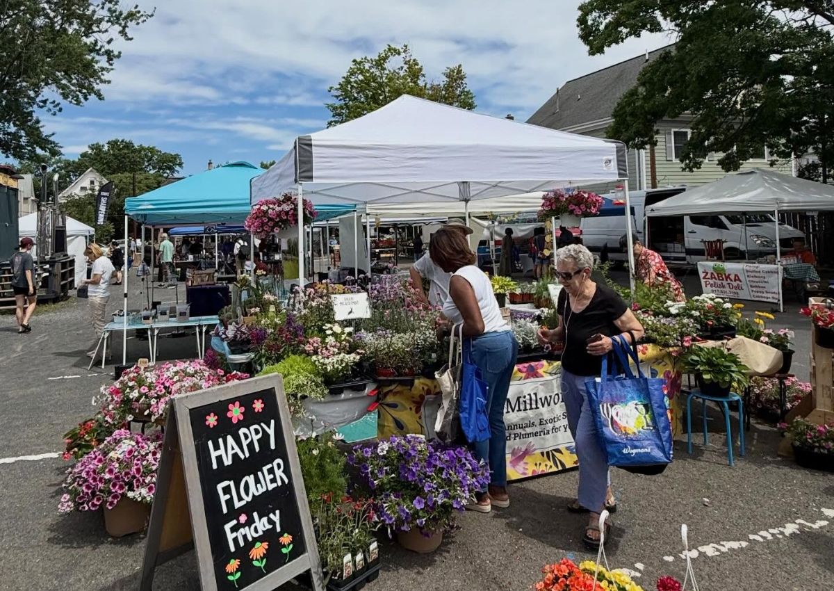Shoppers browse vendors at the Highland Park Farmers Market in Highland Park, New Jersey.