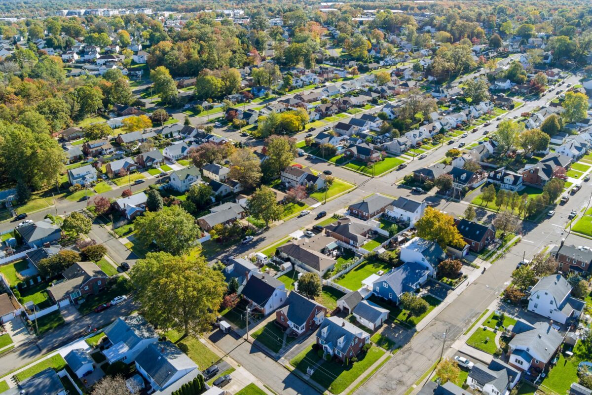 An aerial view of a residential neighborhood in New Jersey, showing homes and tree-lined streets.