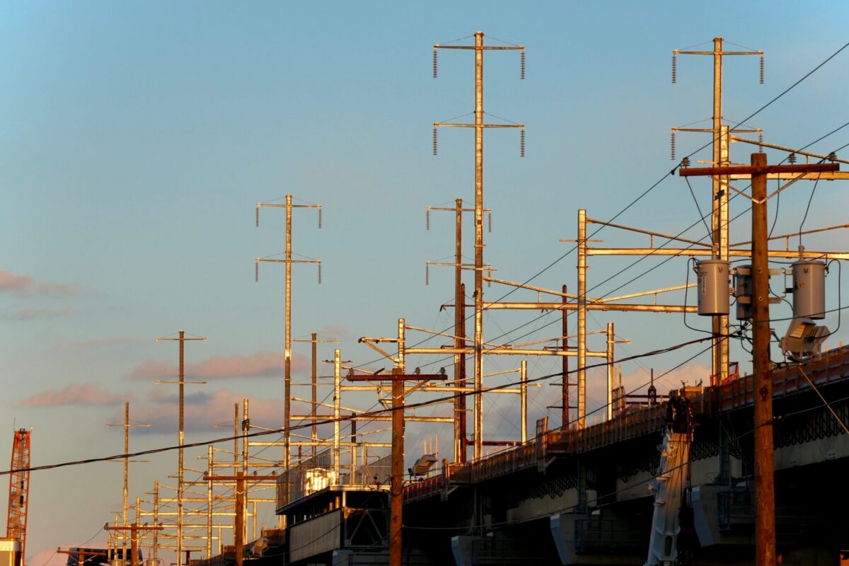 Power lines and transmission infrastructure in Kearny, New Jersey, at sunset