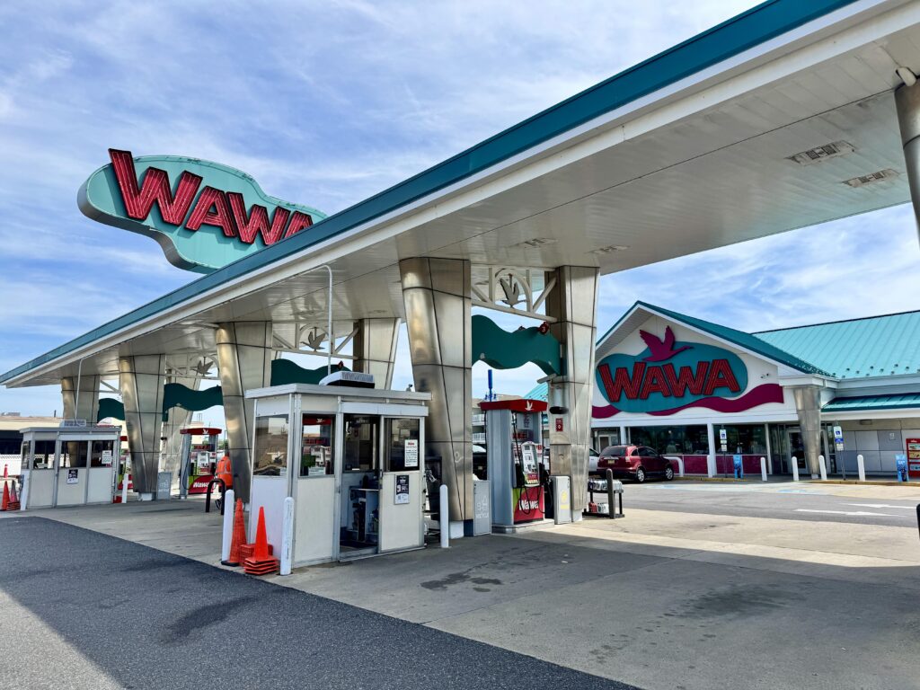 A Wawa gas station and convenience store, a New Jersey staple, with full-service pumps.