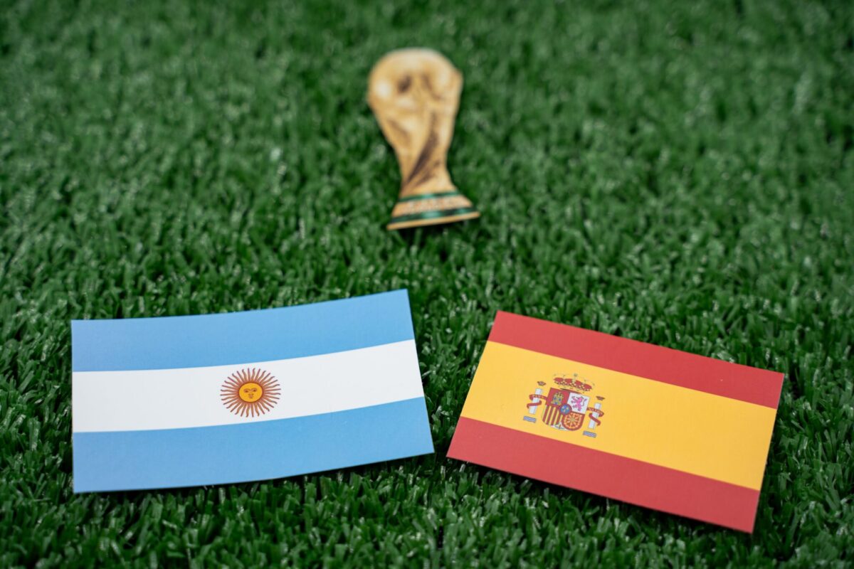 Argentina and Spain flags alongside the World Cup trophy ahead of the FIFA World Cup Final.