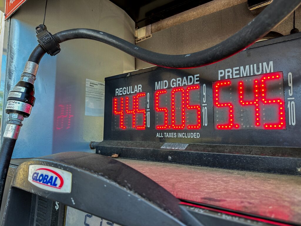 A gas station price sign showing rising fuel costs in New Jersey