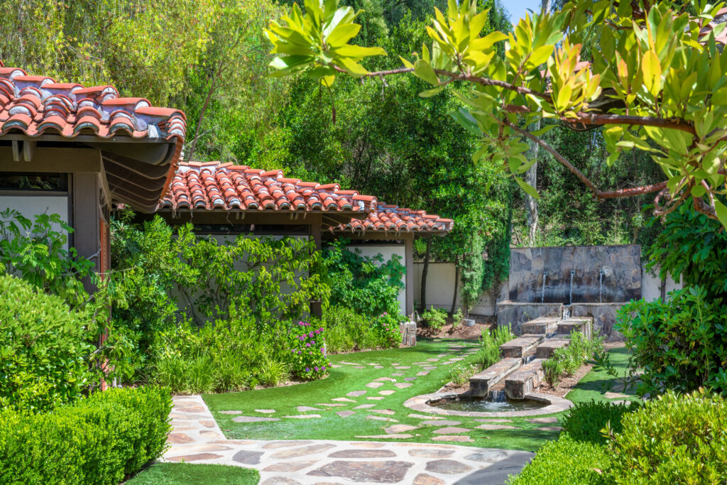 lush garden with fountain and red tile roofs at San Diego resort, Rancho Bernardo Inn