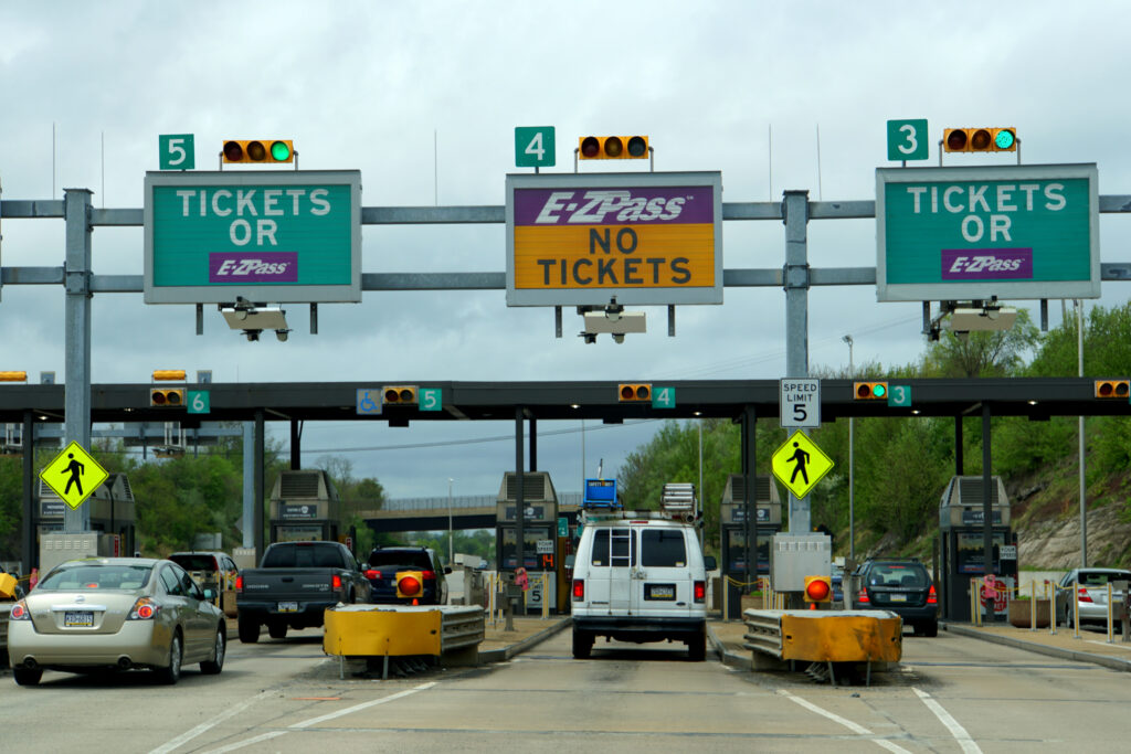 NJ toll booth on highway, representing toll price increases in 2026