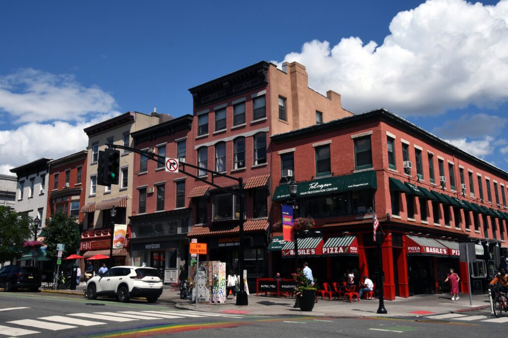 Pedestrians walking along a street in Hoboken, New Jersey