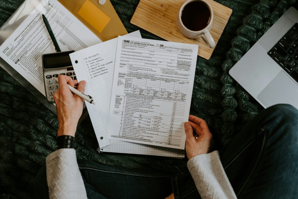 Tax forms and a calculator on a table