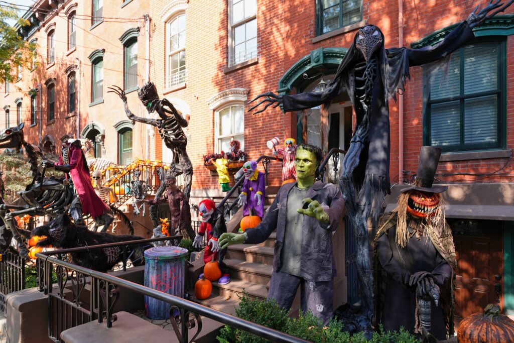 Trick-or-treaters on a Jersey City street at dusk on Halloween