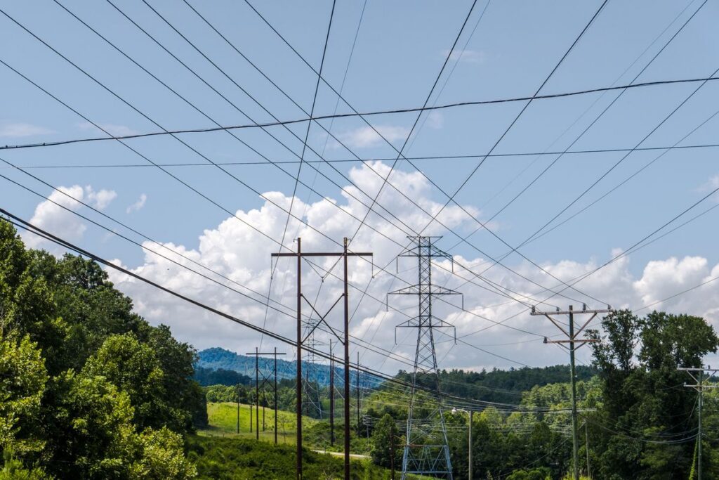 High-voltage electrical transmission lines and power infrastructure against a cloudy sky in New Jersey