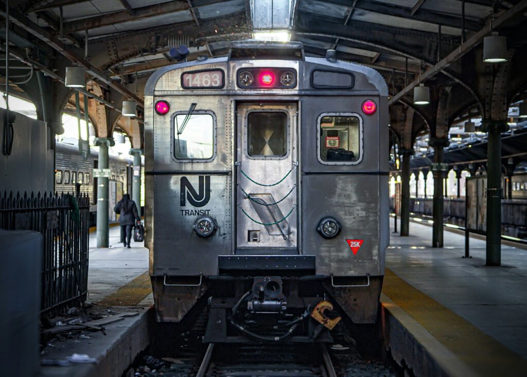 an NJ Transit train sits in the station